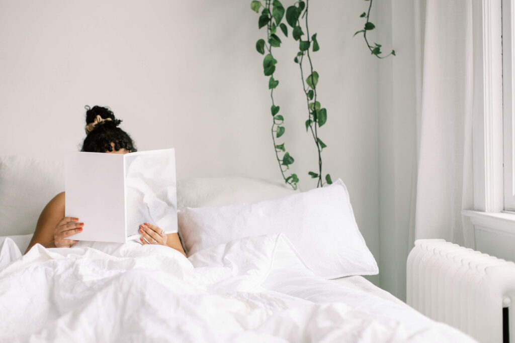 Woman reading in bed.